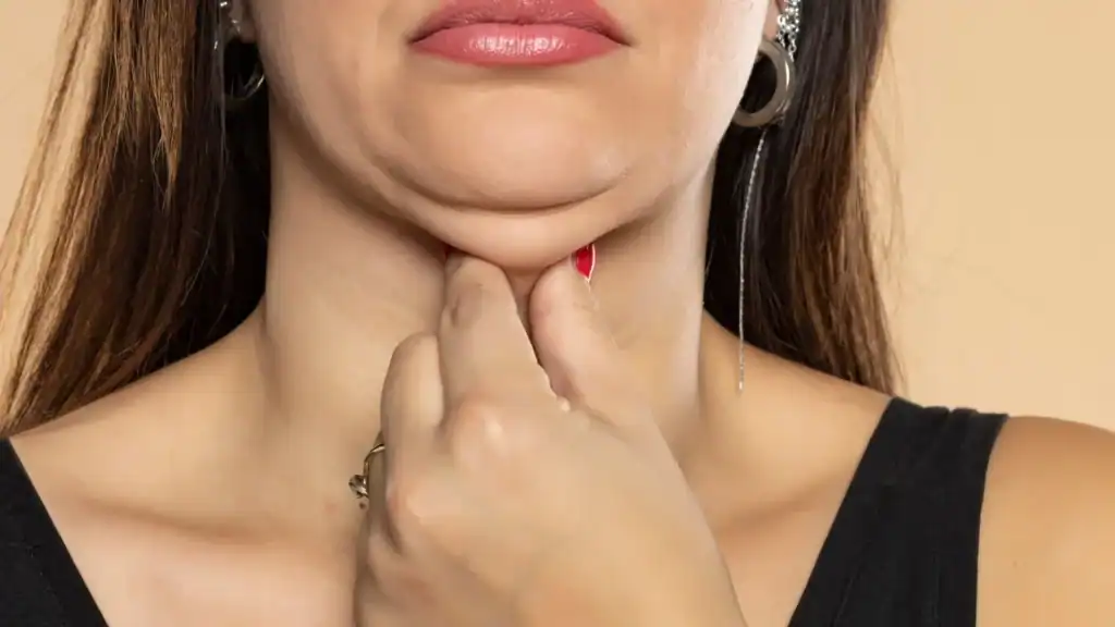 An image of a woman with double chin, sad, worried : Non Surgical Double Chin Removal Treatment in Moseley, UK
